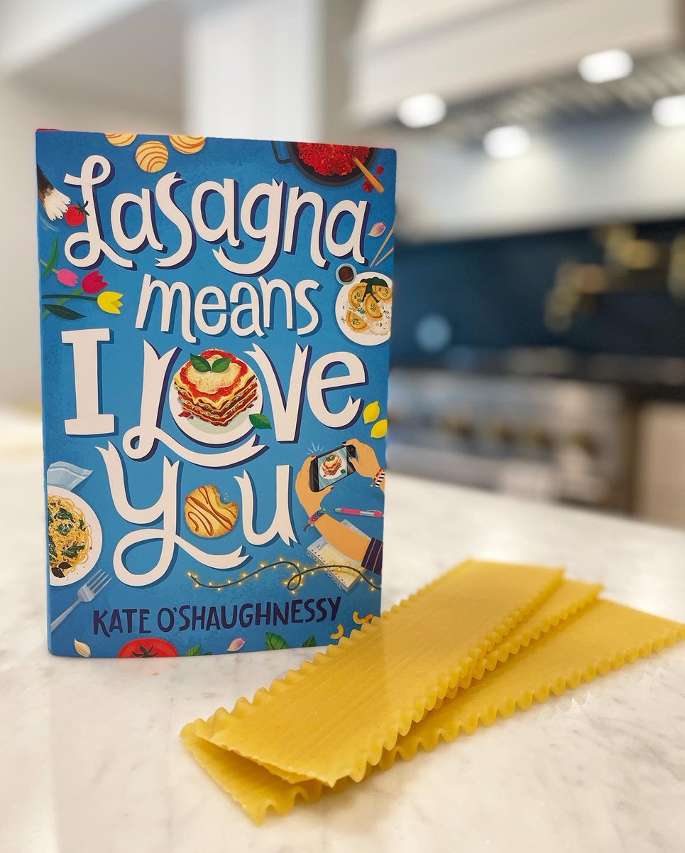 kloshaughnessy's tweet photo. LASAGNA MEANS I LOVE YOU is out in the world….today!! 😱🥰💙

I couldn’t imagine a better place to snap a pic of the gorgeous finished hardcover than in the kitchen, with some leftover lasagna noodles to boot. https://t.co/e2Dl8dXe0t