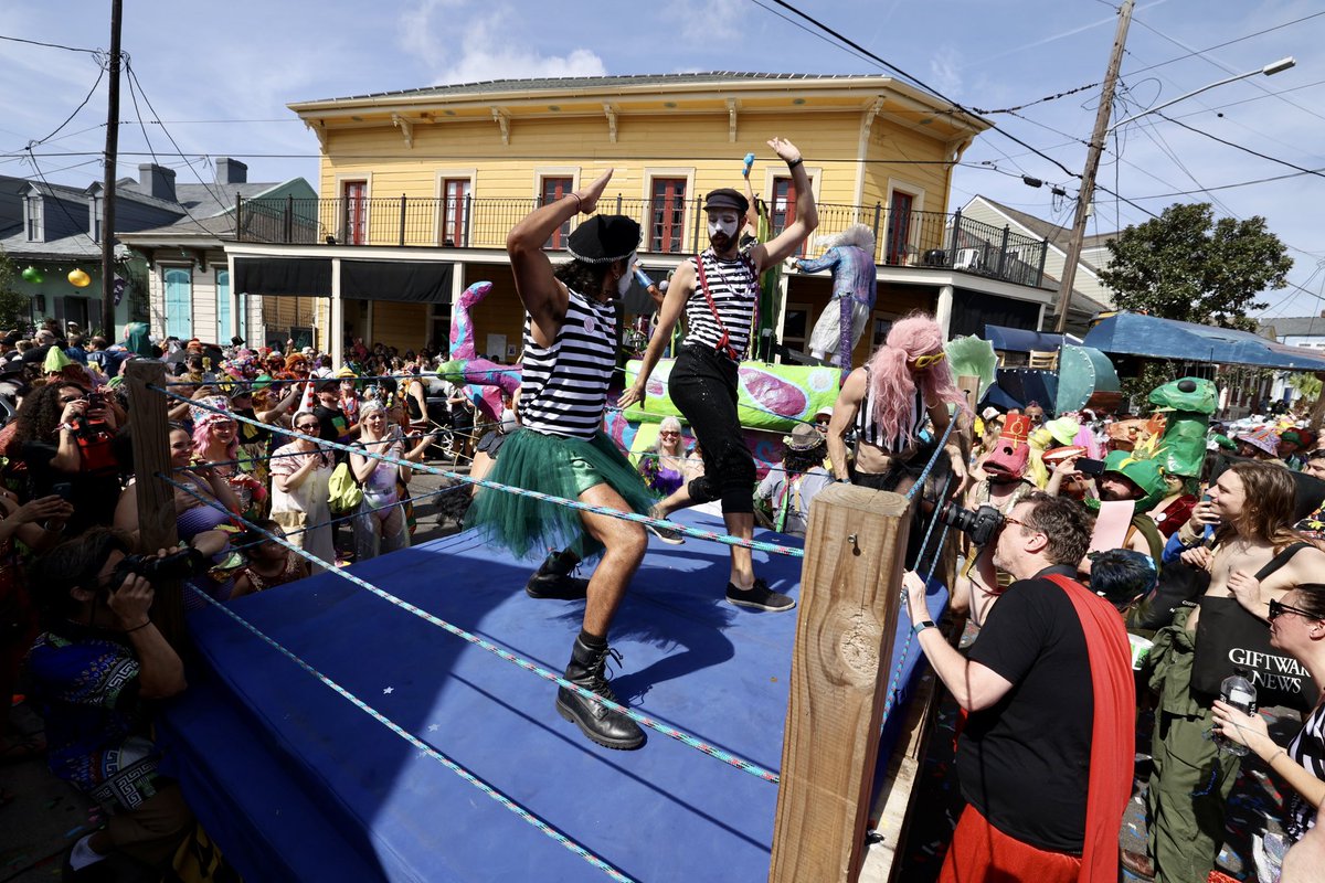 Mimes wrestle in a mobile ring on Royal street