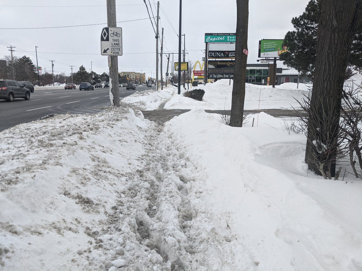 Snow clearing in College Ward for cars vs for people. They're removing snow from the ditches of roads while folks on foot, bike, and mobility scooters have nowhere to exist. #ottbike #ottwalk #ottroll