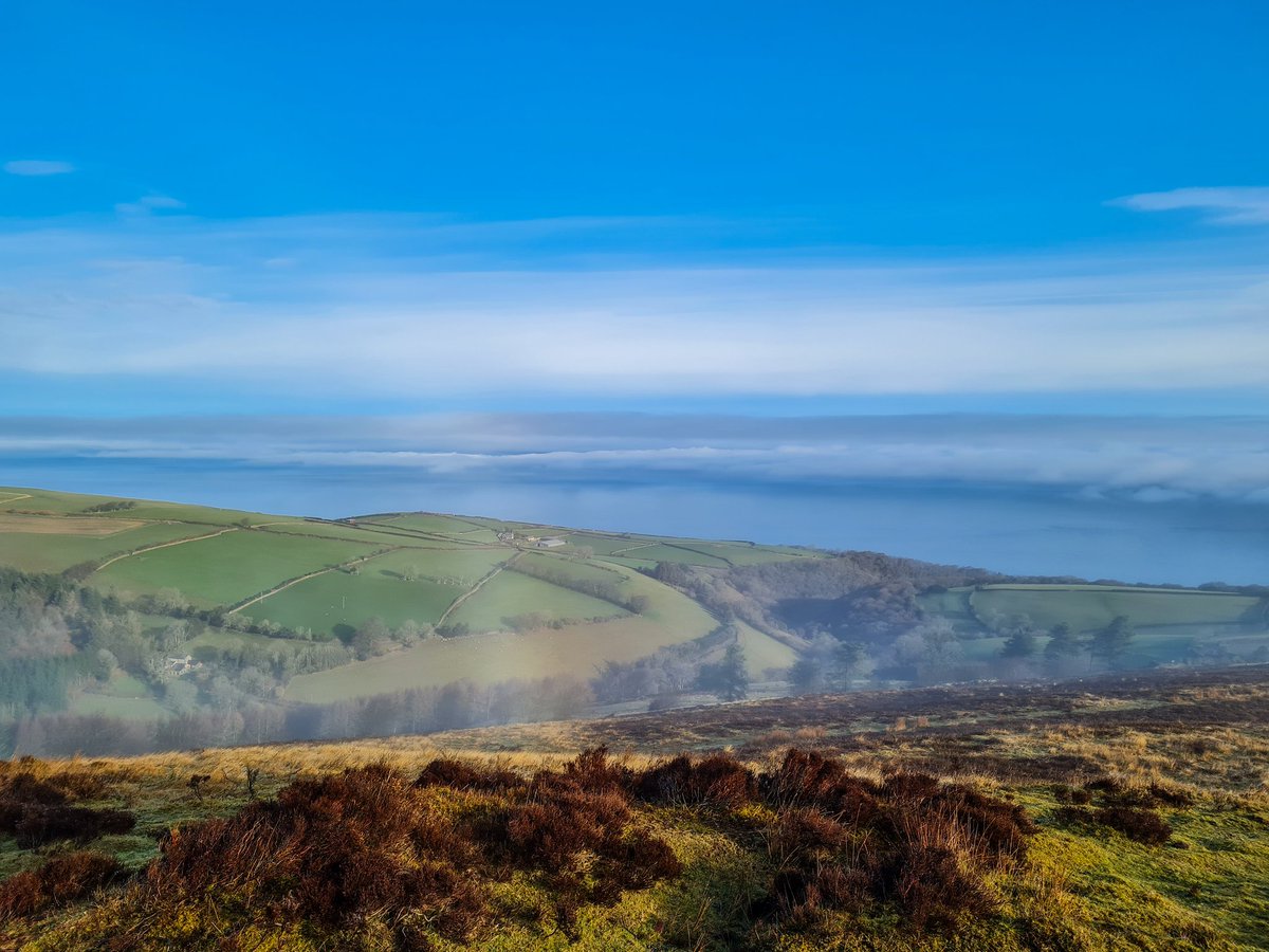 DanJamesENPA's tweet photo. What a wonderful commute. Looking up at North Hill from the kitchen I expected a foggy run to Lynmouth, but by the time I'd done the school run the sun was burning off the mist. #CommutingViews #Exmoor https://t.co/fVgkSQs0pQ