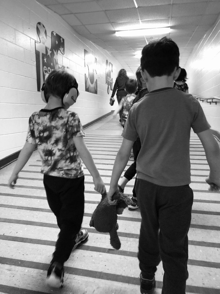 Connections and community at JGES.  Appreciate when one of our friends can help get us to class lending a hand. Brown bear is a good help too.  Love how our staff and students do this daily. #buildingcommunity #helpinghands