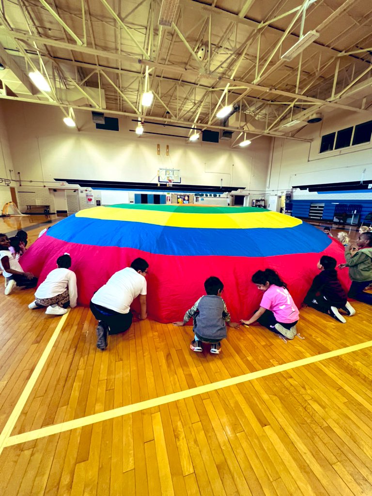 KathleenLatta's tweet image. An oldie but a goodie! Always the best days with K-2 on PARACHUTE DAY! A fun way to provide teachable moments related to teamwork and cooperation!! EVERYONE remembers PARACHUTE DAY!!! 🪂#smilesformiles #corememories #teamworkmakesthedreamwork #RISDmoves #MSTpe