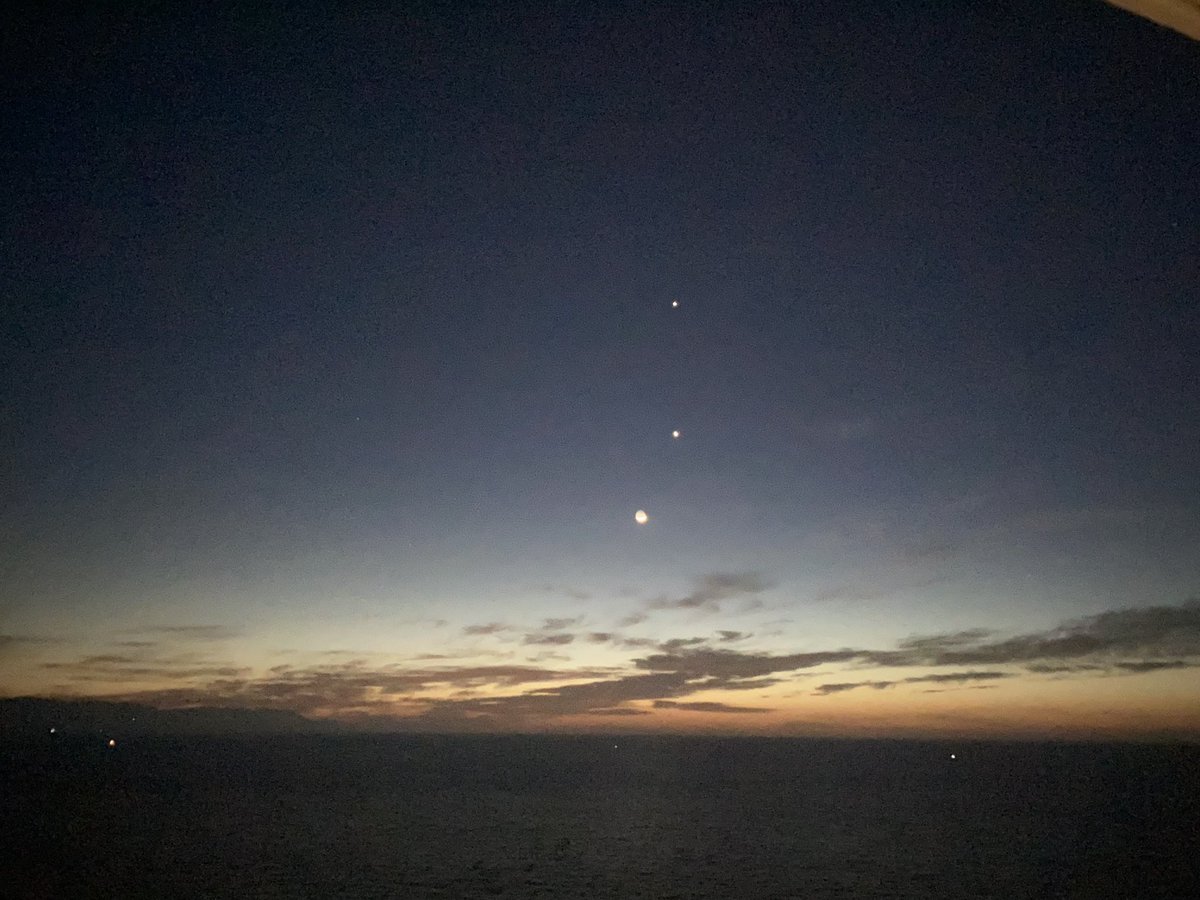Venus and Jupiter lined up, with the moon below it.

From Puerto Vallarta.