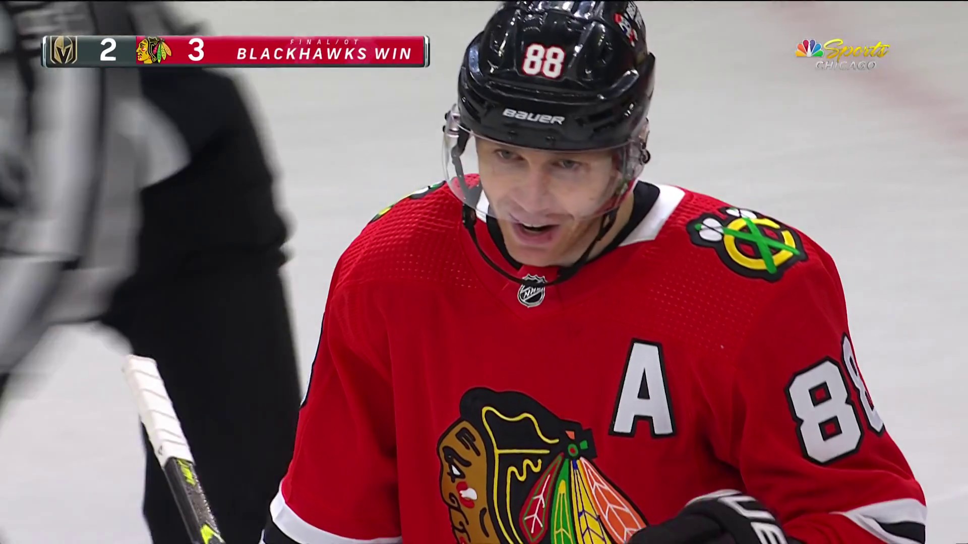 Chicago Blackhawks player Patrick Kane holds up the Big Boy belt that the  players share during the season for outstanding players for a game during  the Chicago Blackhawks celebrate during a victory