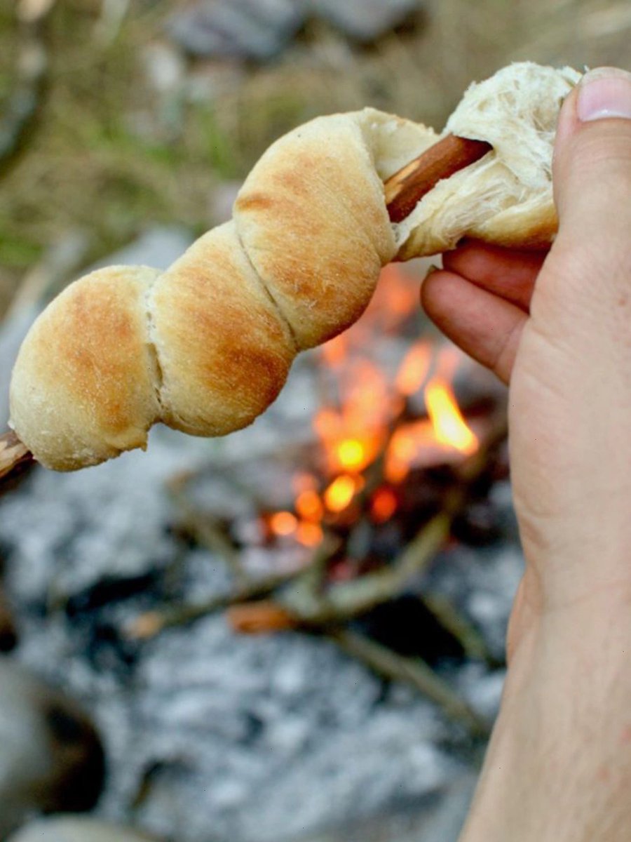 clockitchen's tweet image. Want a delicious and fun outdoor snack? 
Try making stockbrot! Roll fermented dough around a non-toxic branch, bake it over a fire, and enjoy. 
Here's the recipe: 50g butter, 250ml milk, 40g syrup, 420g high gluten flour, and 3g salt.  🍞🌳🔥