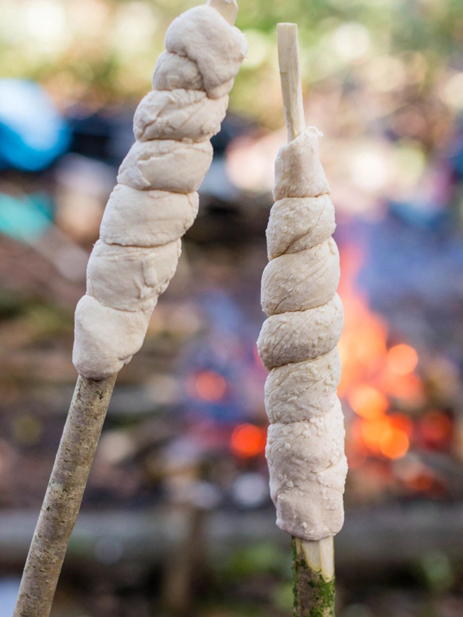 clockitchen's tweet image. Want a delicious and fun outdoor snack? 
Try making stockbrot! Roll fermented dough around a non-toxic branch, bake it over a fire, and enjoy. 
Here's the recipe: 50g butter, 250ml milk, 40g syrup, 420g high gluten flour, and 3g salt.  🍞🌳🔥