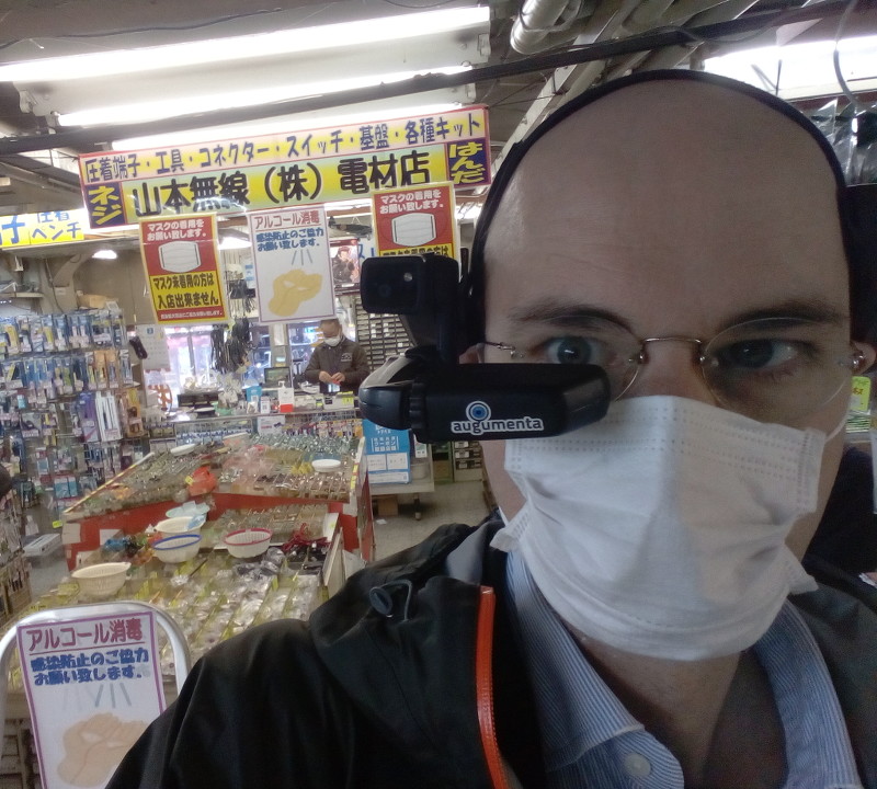 augumenta's tweet photo. Check out our co-founder demoing @augumenta's AR software running on HMT1 #AR #smartglasses to customers from Kyoto to #Akihabara, Tokyo! 🤩 Boosting productivity and revolutionizing the workplace, one customer at a time. #smartglasses #innovation #秋葉原 #industrialAR https://t.co/qKnJu2GpfX