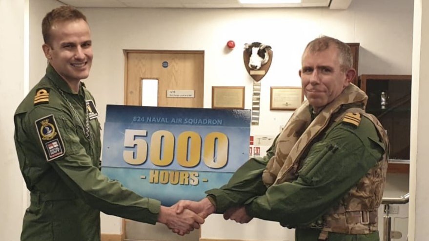 Members of 824 Naval Air Squadron #824NAS congratulated Lt Cdr Dave “DT” Thomas (right) who clocked up his 5000th flying hour yesterday. Squadron CO Cdr Chris Jones (left) said DT was a true stalwart of the Fleet Air Arm and Merlin Helicopter Force #TeamCuldrose @faaoa