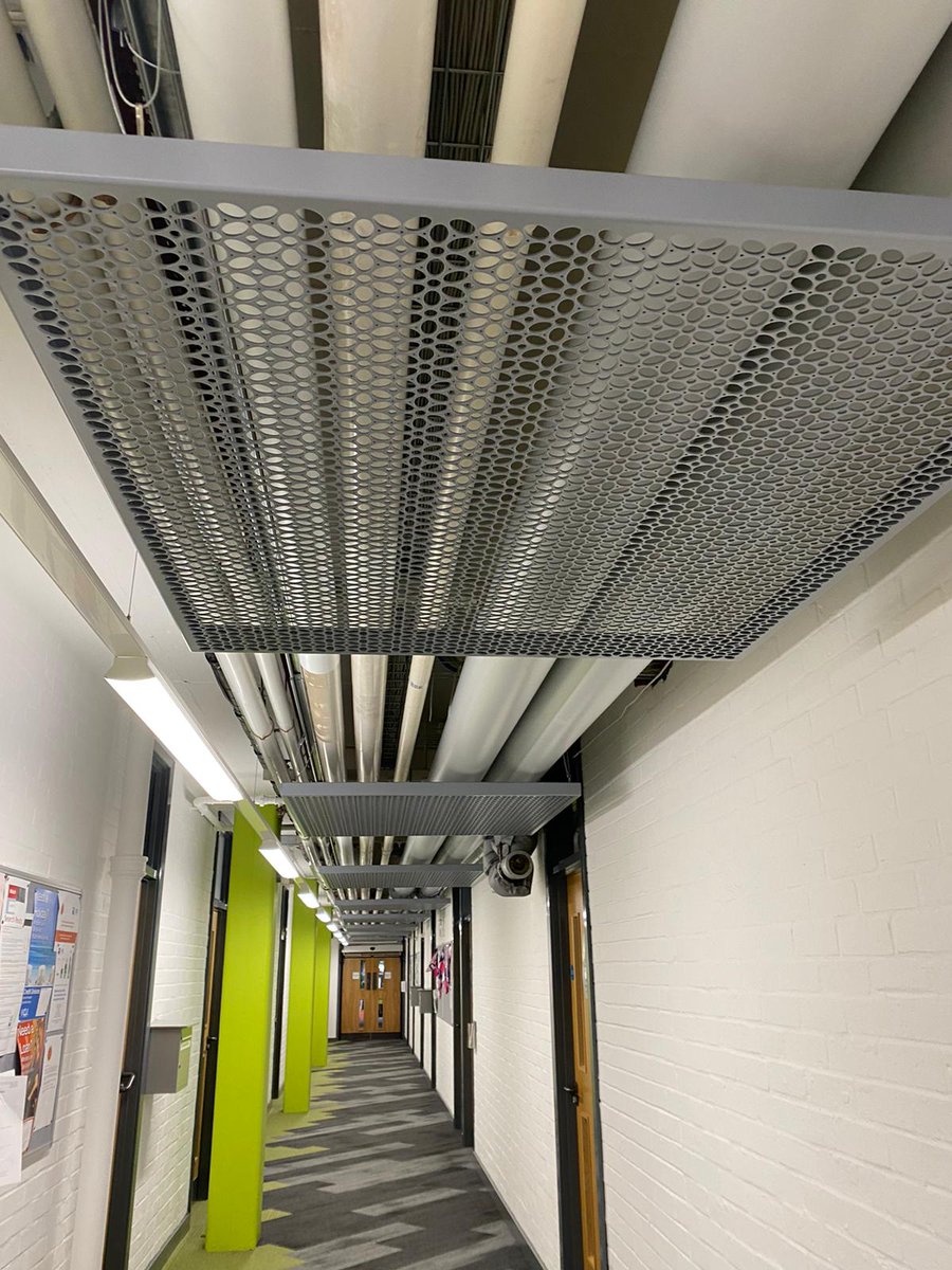 Graepels's tweet photo. For Open University students in Milton Keynes, looking up will show our beautiful decorative panels!
Our 'Corolla' design acts as cladding to hide ventilation piping in this hallway.
#Graepels #decorativemetal #perforatedmetal #perforatedsheet #ceilingcladding #interiordesign https://t.co/PvnKEXzBfL