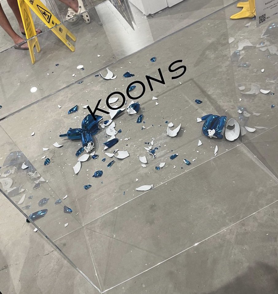 PopBase's tweet photo. A woman accidentally knocked over a $42,000 Jeff Koons Balloon Dog sculpture at an art fair in Miami, causing it to shatter. https://t.co/NBENN3US2f
