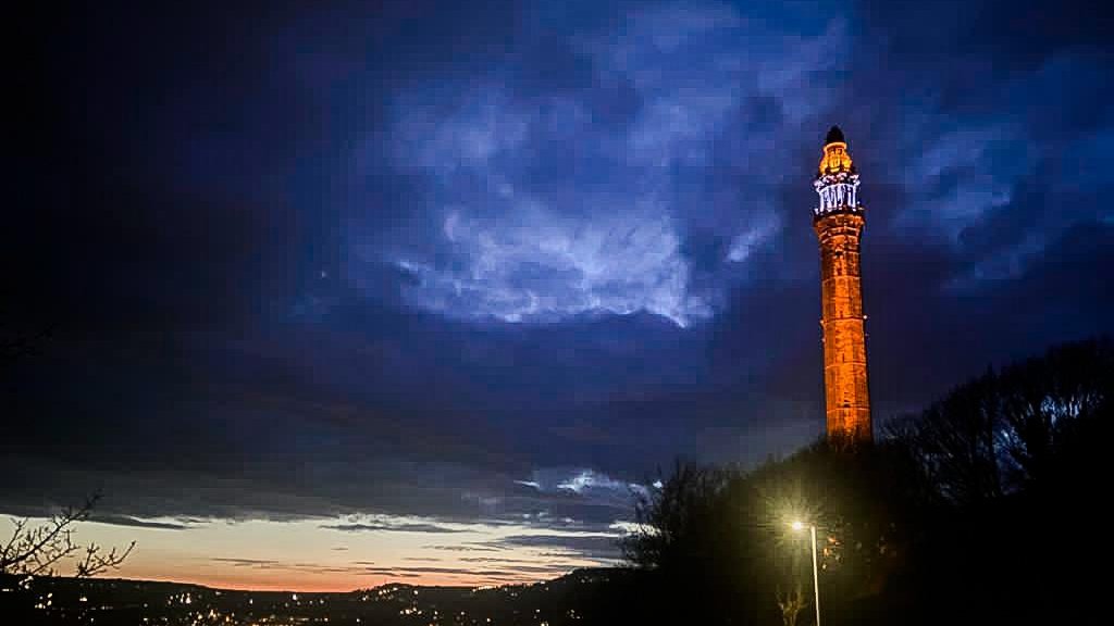 Calderdale's tweet photo. This Friday marks one year since the invasion of Ukraine. It's a time to reaffirm our unwavering solidarity and support for Ukrainians.

This week, Wainhouse Tower is lit blue and yellow and the Ukraine flag is flying at Halifax Town Hall as a mark of respect.

 #StandWithUkraine https://t.co/mUfAmTYLlJ