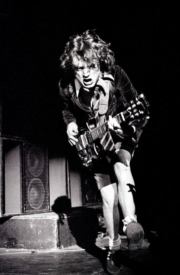 crockpics's tweet photo. Angus Young at the Hammersmith Odeon, 1979. Photo by David Corio. https://t.co/T6iXIRtcJH