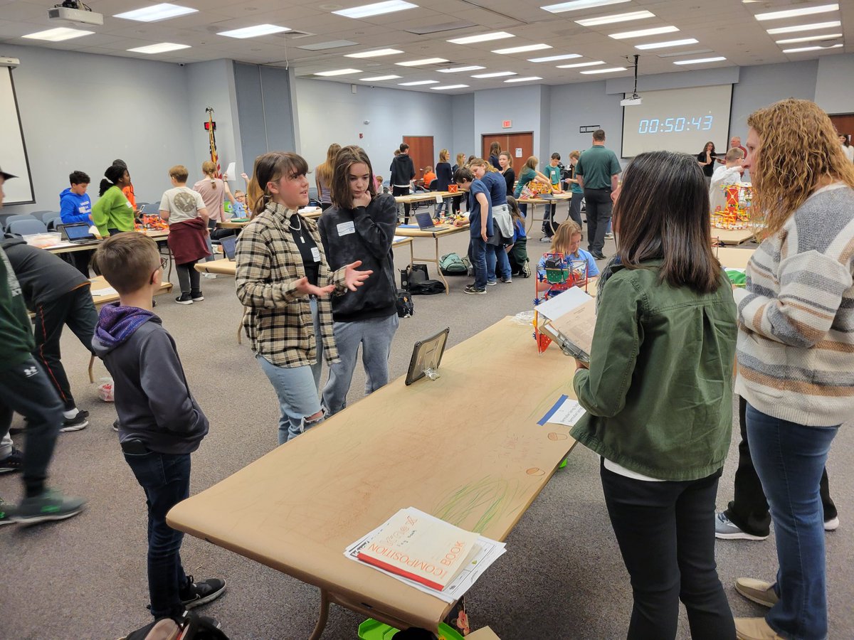 BSMS Eagles at the LIU STEM design competition with their CO2 filtering machine, Philter, which plants trees.