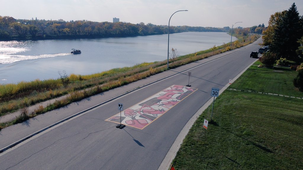 CoolStreetsWPG's tweet photo. #PaintThePavementWPG murals we curated for @cityofwinnipeg as part of their pilot traffic calming on the Lyndale dr - Enhanced Summer Bike Route. https://t.co/Eot8VXDs3y