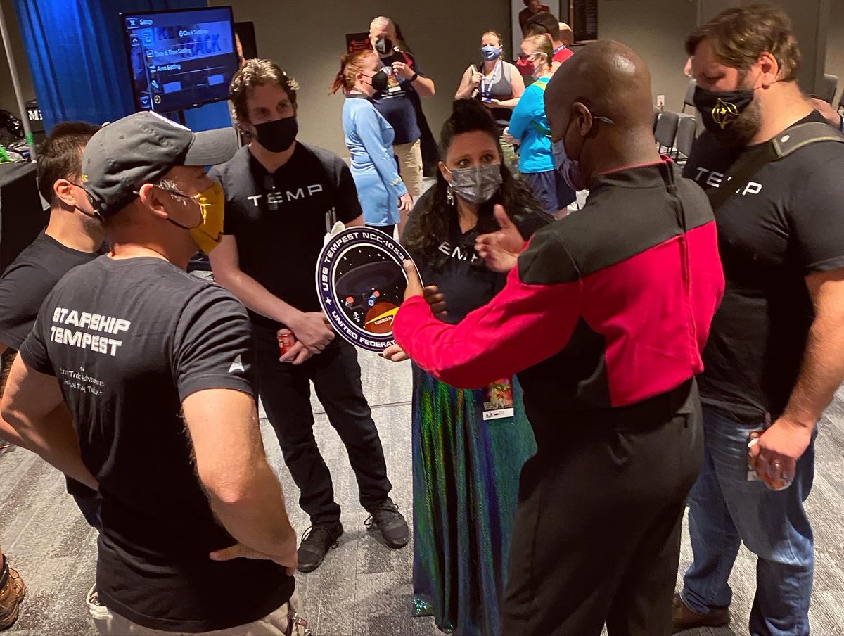 starshiptempest's tweet photo. At #Dragoncon in 2022, Joe Campbell surprised the crew of the #StarshipTempest with our mission patch logo in the form of a big beautiful sign to display during our panels for #TrekTrack! What an awesome gift. 
❤️🖖🏼❤️ 

#ActualPlayPodcast #ttrpgcommunity https://t.co/S34qw6Km9d