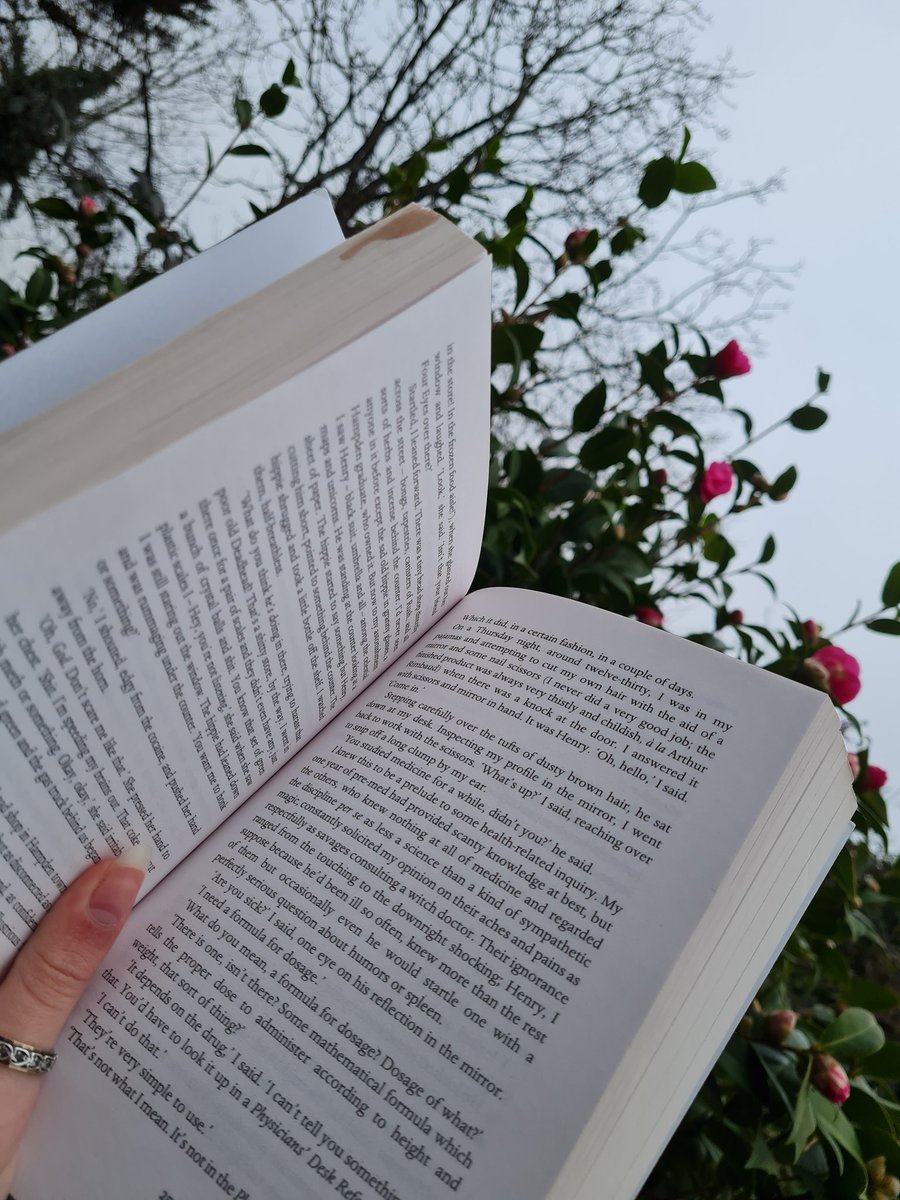HumansAreStup1d's tweet photo. I took this pic of me reading outside earlier. The flowers are starting to bloom again, it's soo pretty :) https://t.co/6EHKi7TO7l