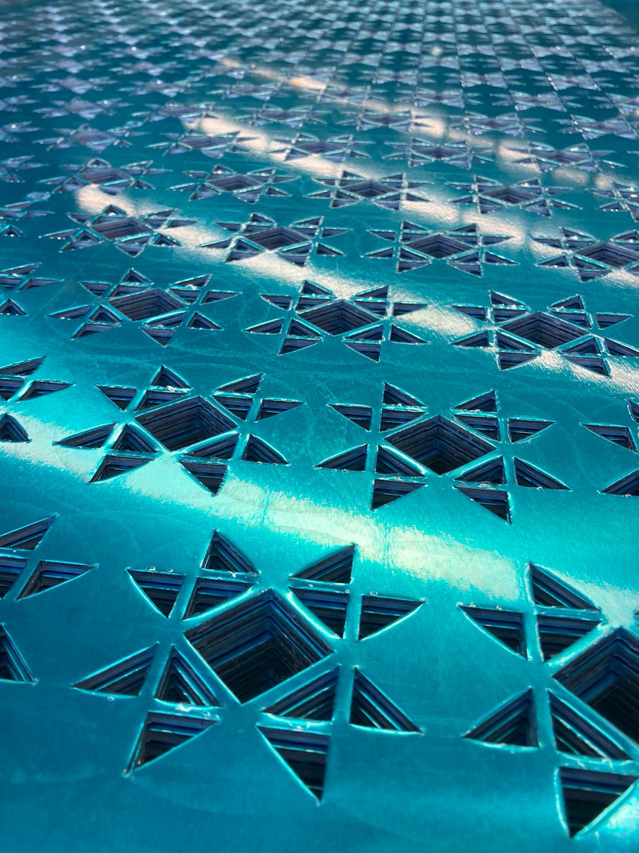 This perforated aluminium sheet is currently being processed for custom facade panels.