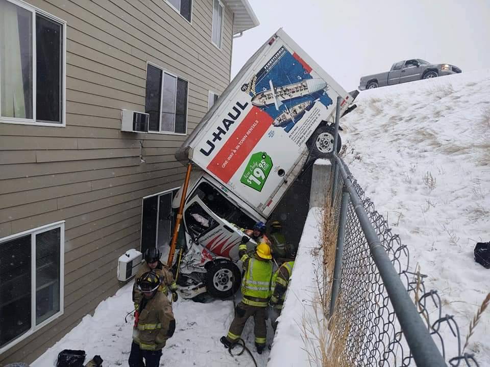 From RCFD: 

The Rapid City FD  responded to an accident this morning. This U-Haul ended up in an embankment and over this retaining wall right by an apartment building. The driver had to be extricated and was transported to the hospital with non life threatening injuries.