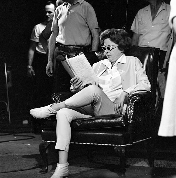 Director Ida Lupino looks over the script on set of “The Twilight Zone” 1963 episode, "The Masks."