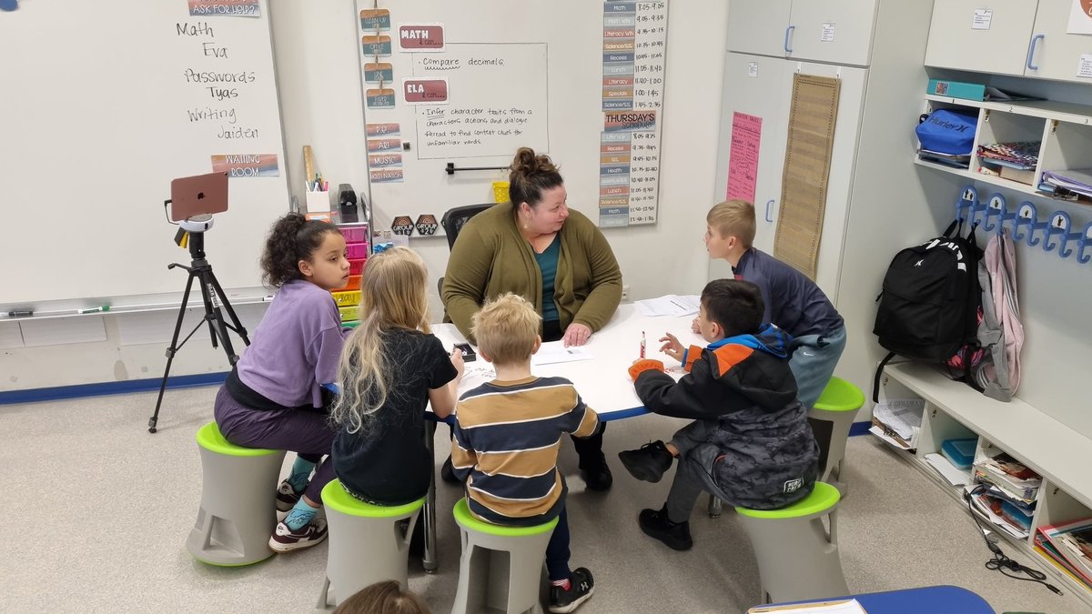 Netzaberg_ES's tweet photo. Dr. Becker is leading a small group of students through multiplying fractions by whole numbers. @DoDEA_Europe @DoDEAEuropeEAST @DoDEA https://t.co/0Btnu4K3vG