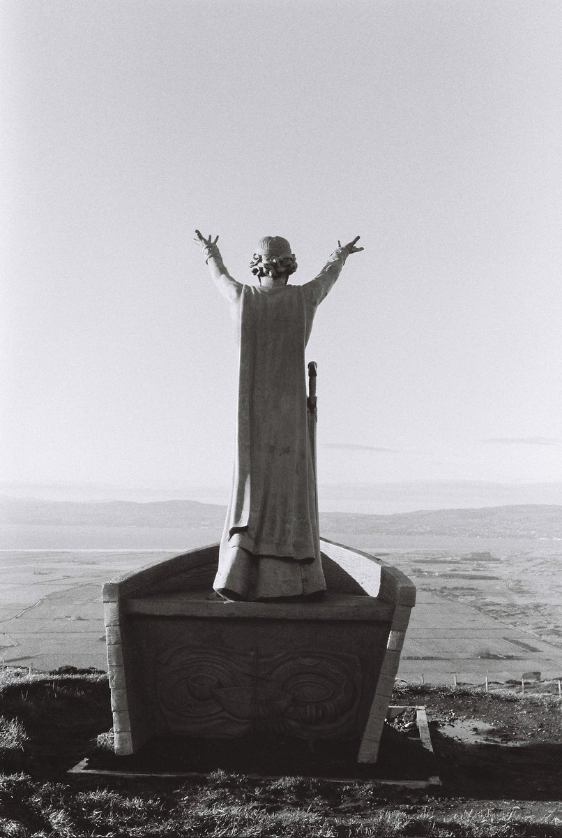 MonoMomento's tweet photo. Gortmore Viewing Point on Binevenagh Mountain. 
The famous statue of Manannan Mac Lir is located on Bishop’s Road – part of the excellent Causeway Coastal Route. @VisitCauseway @TourismNIreland @weirdwalk #folklore #myths #legends #viewpoint #filmphotography #nikon #kentmere #bnw https://t.co/BzLgzxvZm3