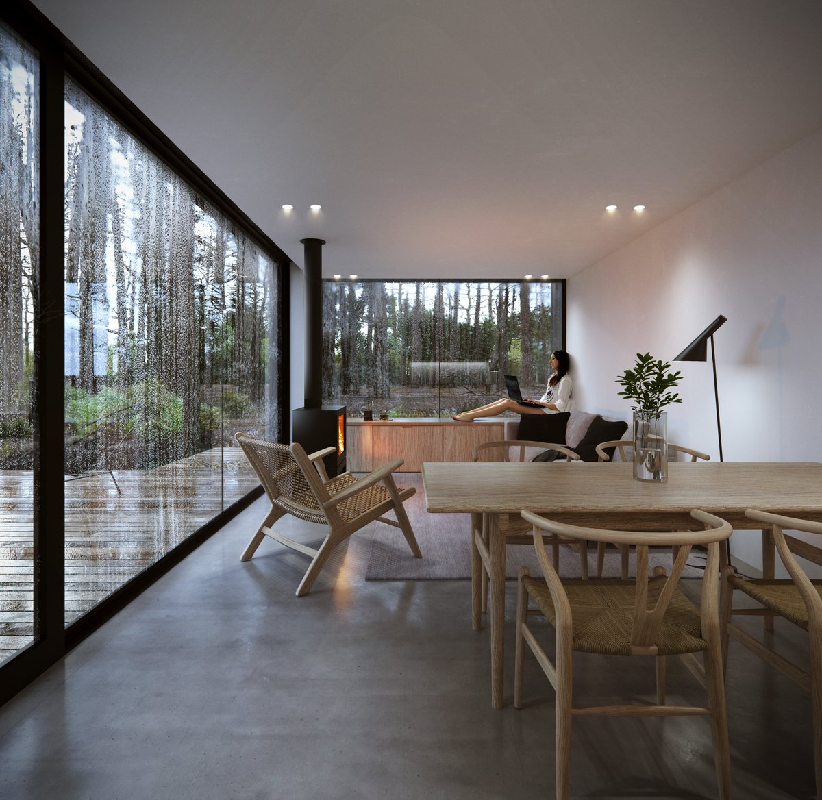 The interior of Woodland Retreat is purposely minimal allowing guests to focus on the scenic views no matter the weather. Log burner, picture window and integrated window seat provide the perfect sanctuary on a stormy day. #contemporaryarchitecture  #woodlandretreat #cabinlife