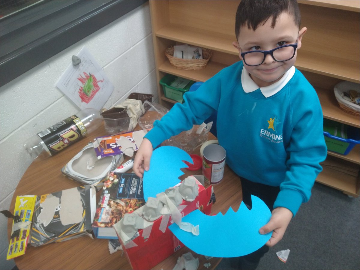 EPA_Year1's tweet photo. This super star is taking making his junk model dragon very seriously. He has his design stuck to the wall and is talking through every step to make sure it is the same as his picture! Well done - we are very proud of how it is turning out. #eggboxdragon @ErminePrimary https://t.co/6T3QmCsH1x