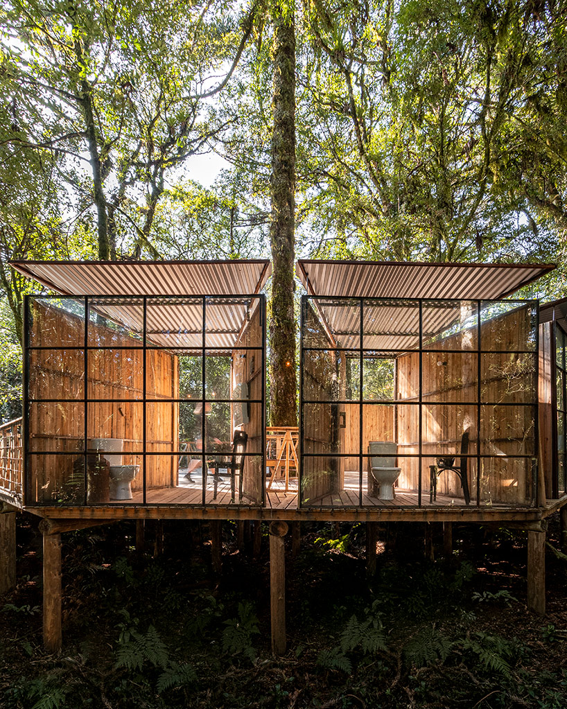 designboom's tweet photo. a set of wooden restroom cabins peeks through the treetops of native forest in são francisco https://t.co/d4IrfdJPqD https://t.co/SNLumyCvAQ