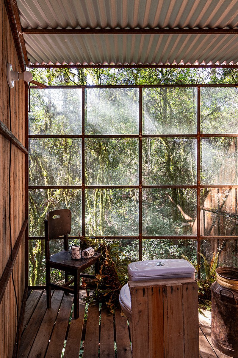 designboom's tweet photo. a set of wooden restroom cabins peeks through the treetops of native forest in são francisco https://t.co/d4IrfdJPqD https://t.co/SNLumyCvAQ