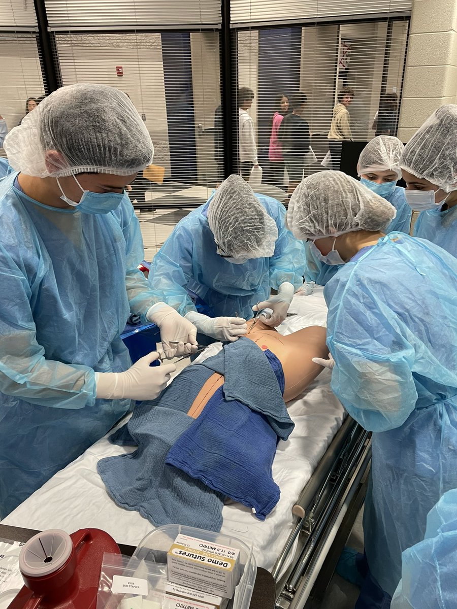 AshleySteinert1's tweet photo. Medical academy seminar Ss learning how to set up a sterile field in the OR, basic sutures, and how to remove staples and sutures!  Ss had to differentiate between sterile and aseptic procedures #mcslearn #proudtobeajet https://t.co/2VOyYNKWQa