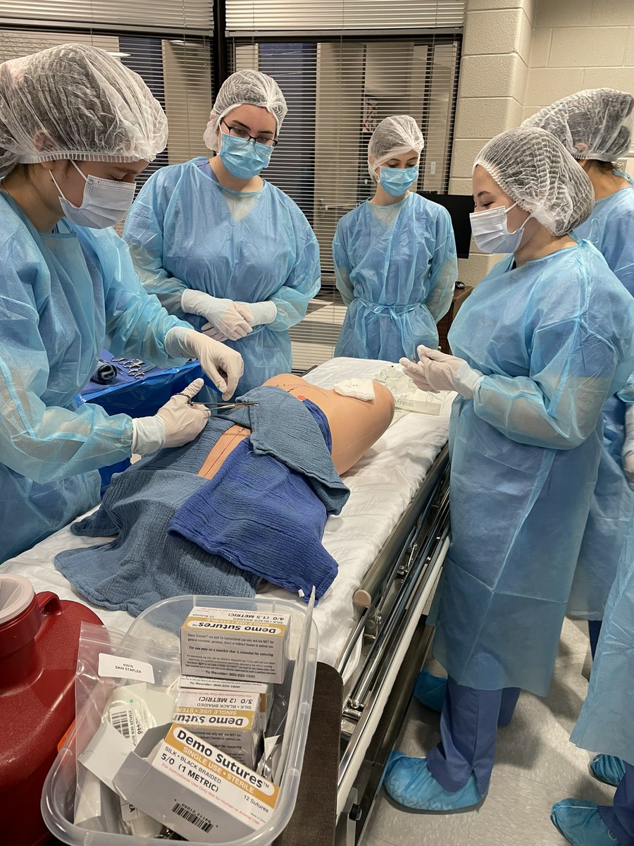 AshleySteinert1's tweet photo. Medical academy seminar Ss learning how to set up a sterile field in the OR, basic sutures, and how to remove staples and sutures!  Ss had to differentiate between sterile and aseptic procedures #mcslearn #proudtobeajet https://t.co/2VOyYNKWQa