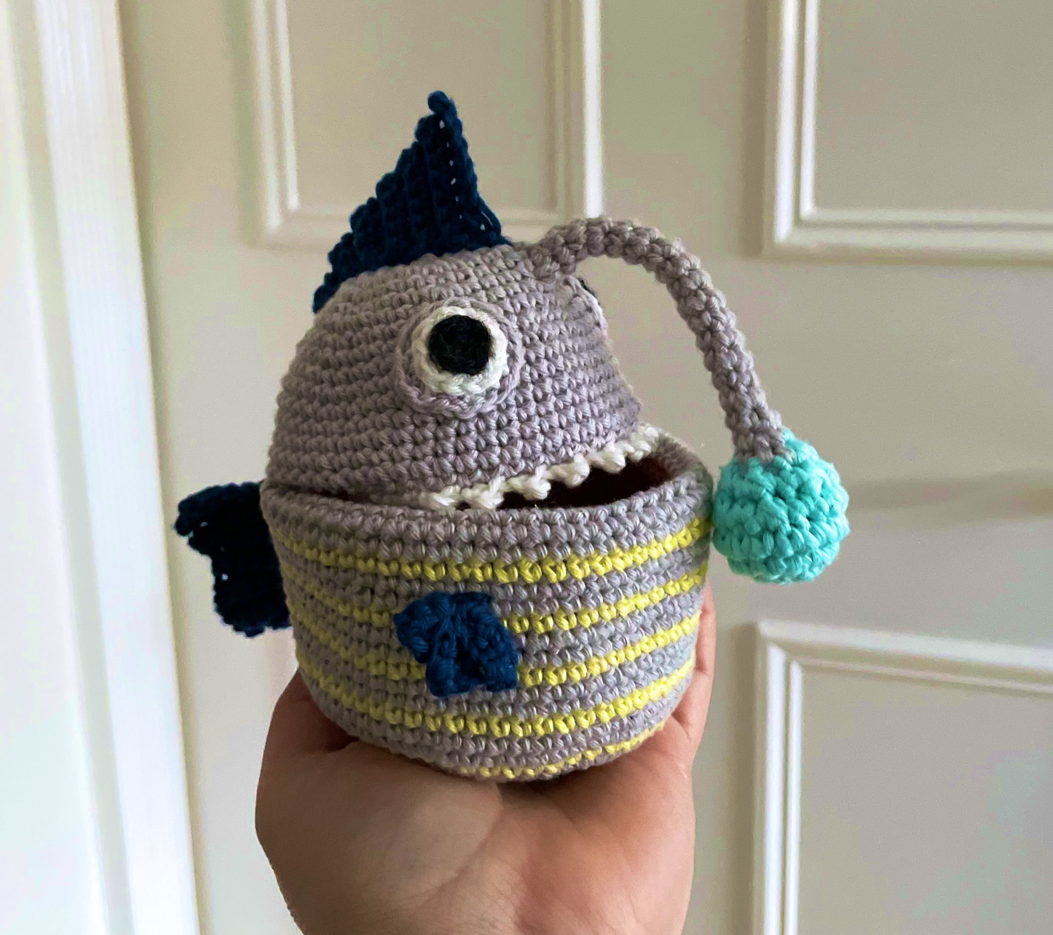 Pip on X: I made an anglerfish to keep my hair elastics in! The lure at  the end of its fishing rod is made from glow in the dark wool, so it