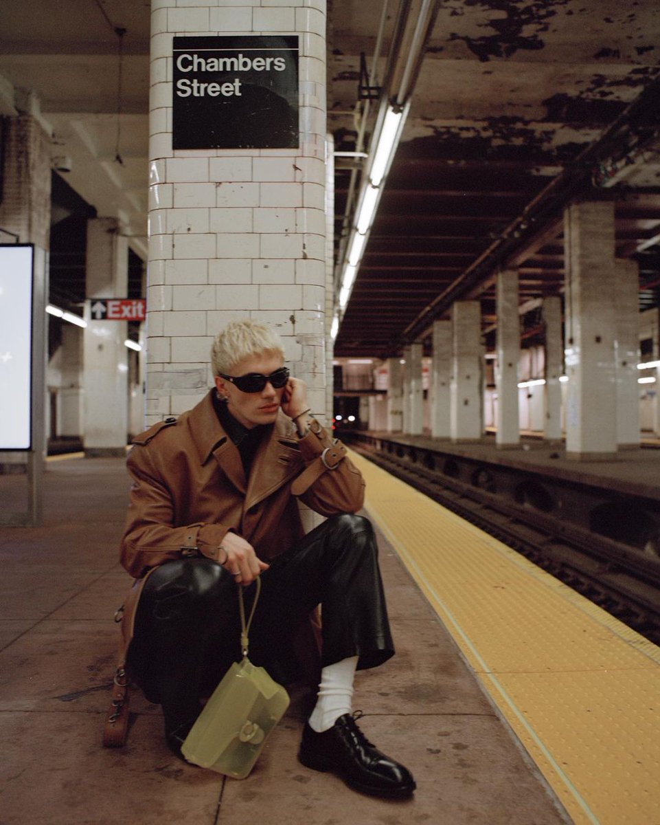 Coach's tweet photo. New York minute with #TannerReese. ⚠️ The creator/model came to our show last week and brought a neon plus-one. (These bags drop 3/2.) #CoachFall23 #NYFW #CoachNY https://t.co/4qRCIgg8Gf