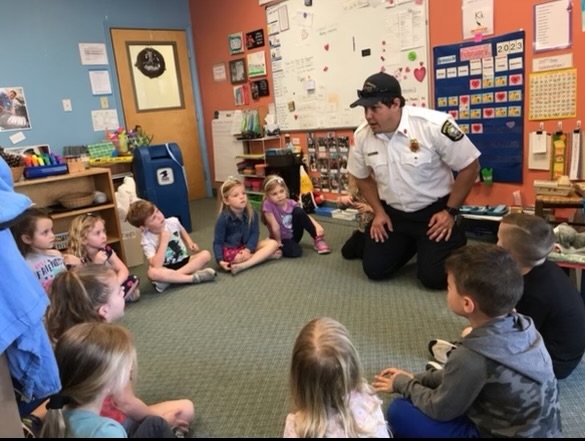 Lt. Seth Holzopfel visiting with pre-schoolers at The Learning Tree.  Never too young to learn about preparedness!  #EARNIT