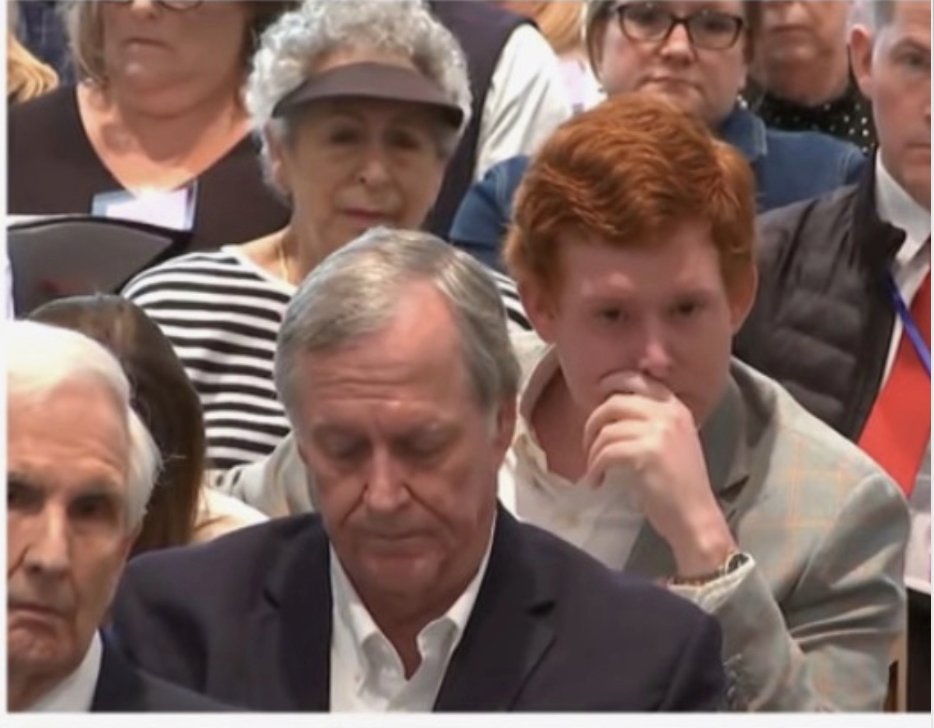Help me out here .... Is this John Grisham sitting in front of Buster?????