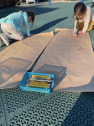Enjoying this amazing weather by creating self portraits outside, each kiddo took turns tracing each other and then adding their own flair to their portraits!