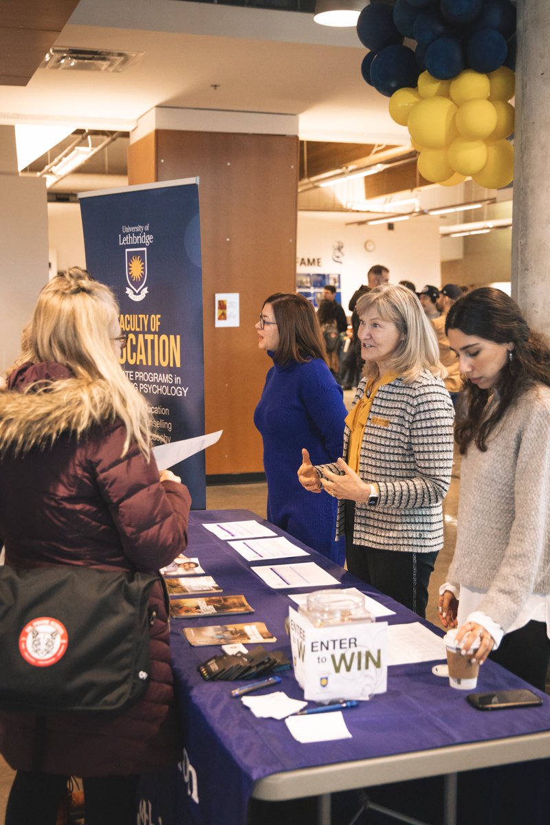 ULethbridgeEdu's tweet photo. @SWATCA has taken over campus, teachers from across southern Alberta are everywhere (we love to see it) and the energy is crazy! If you're attending, be sure to stop by our grad studies table in the 1st Choice Savings Centre AND say hi to our student volunteers in red! 🍎📚 #yql https://t.co/ExtzO1PYsL