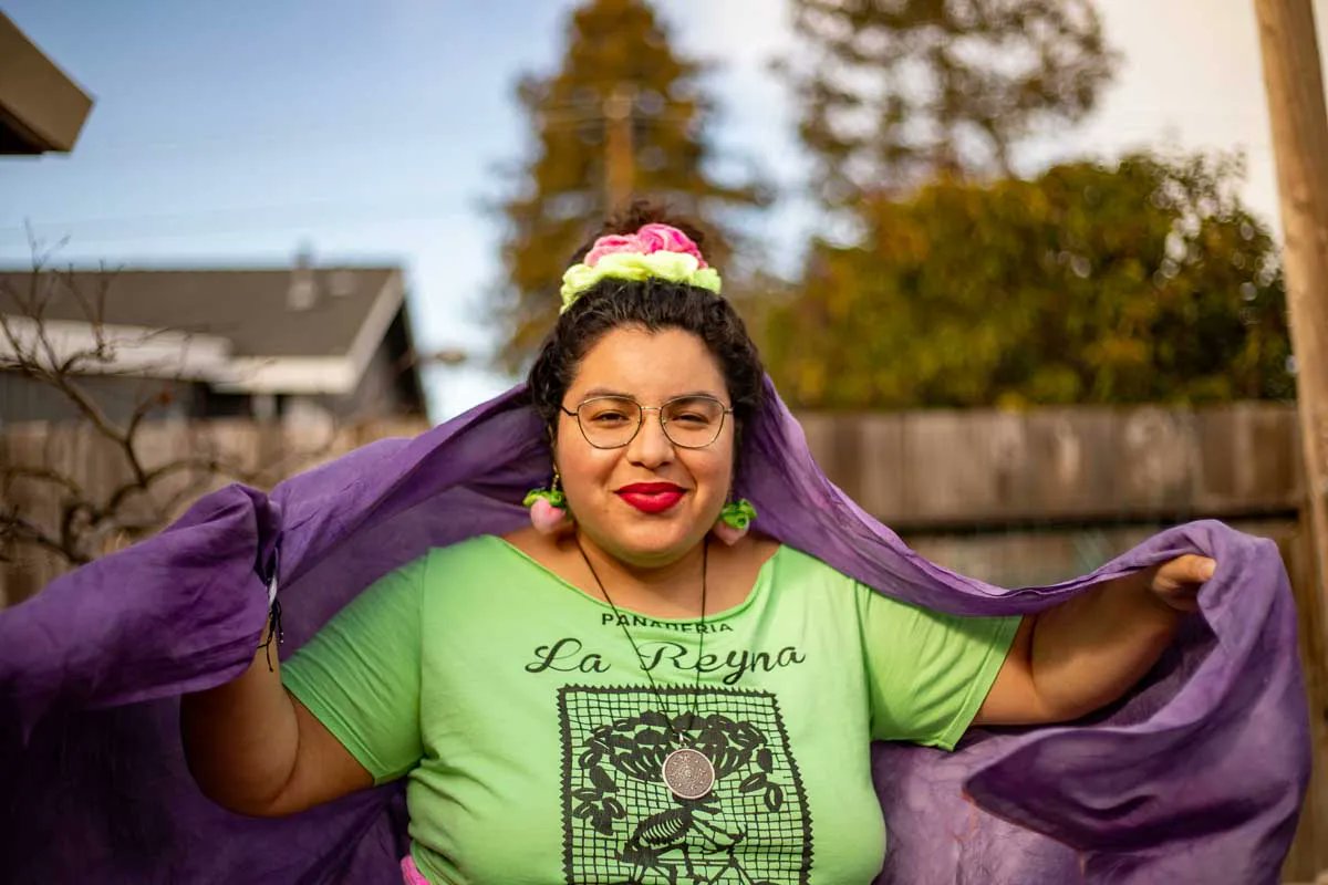 Three woven baskets hold round pillows, each painted with a bright sun-like geometric design. On the wall behind them, scrawled in curly cursive, is the message, “Hug a pillow/ Hug your ancestors/Notice, feel, breathe.” 

buff.ly/3IOoiKa
