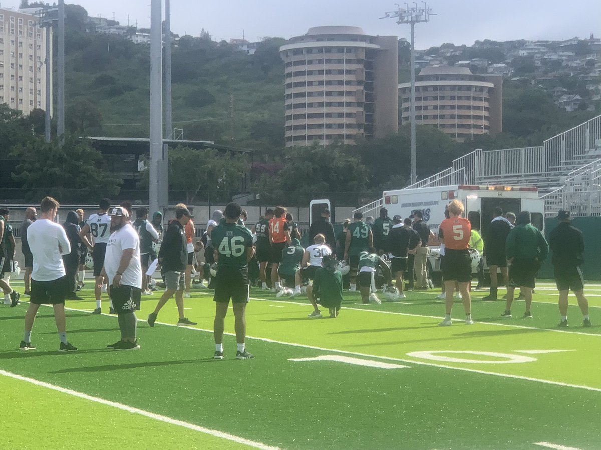 Scary moment at this morning’s #HawaiiFB practice. R-FR DB Kona Moore was in a player collision crossing middle in a red zone drill. Remained down stiff and an ambulance summoned. Moore is being taken to an ER. Team solumn. HC Timmy Chang said concussion is best-case scenario.