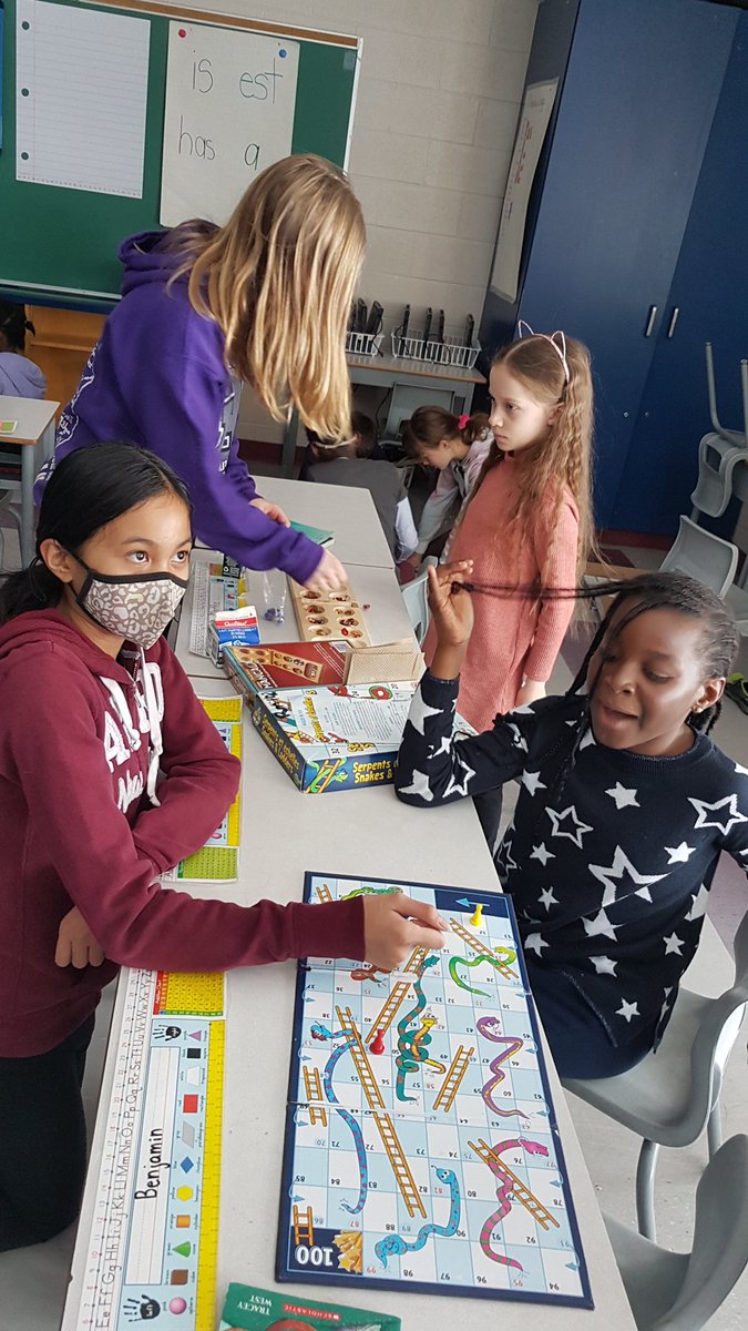 AlaneMartinuzzi's tweet photo. The Gr. 5 student paired up with some Gr. 2 students to play board games and teach them Mancala, Otrio and Blokus. Learning and fun on this #snowday @StClareOCSB https://t.co/UwS7McQdvf