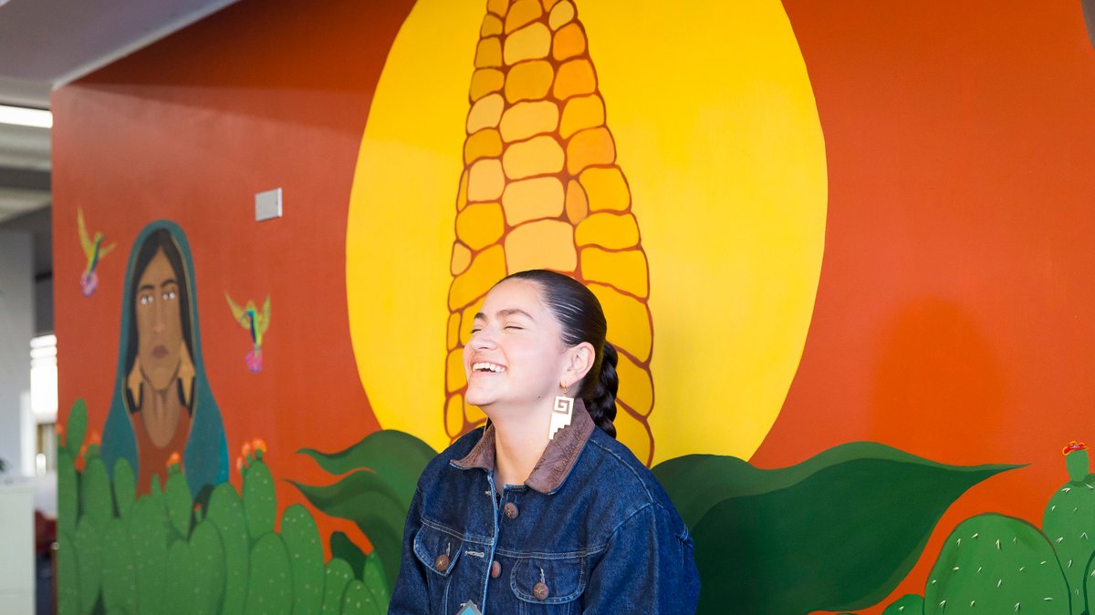 UNC_Colorado's tweet image. Have you seen the new mural inside Michener Library yet?! Mexican Chicana alum Brenda Vargas alongside Chicano muralist Leo Tanguma painted colorful and moving art on the first floor! An unveiling celebration was held last week – go check it out!