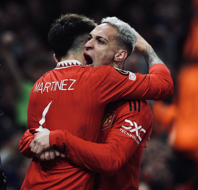 Lisandro Martinez hugs Antony after scoring United’s second goal.