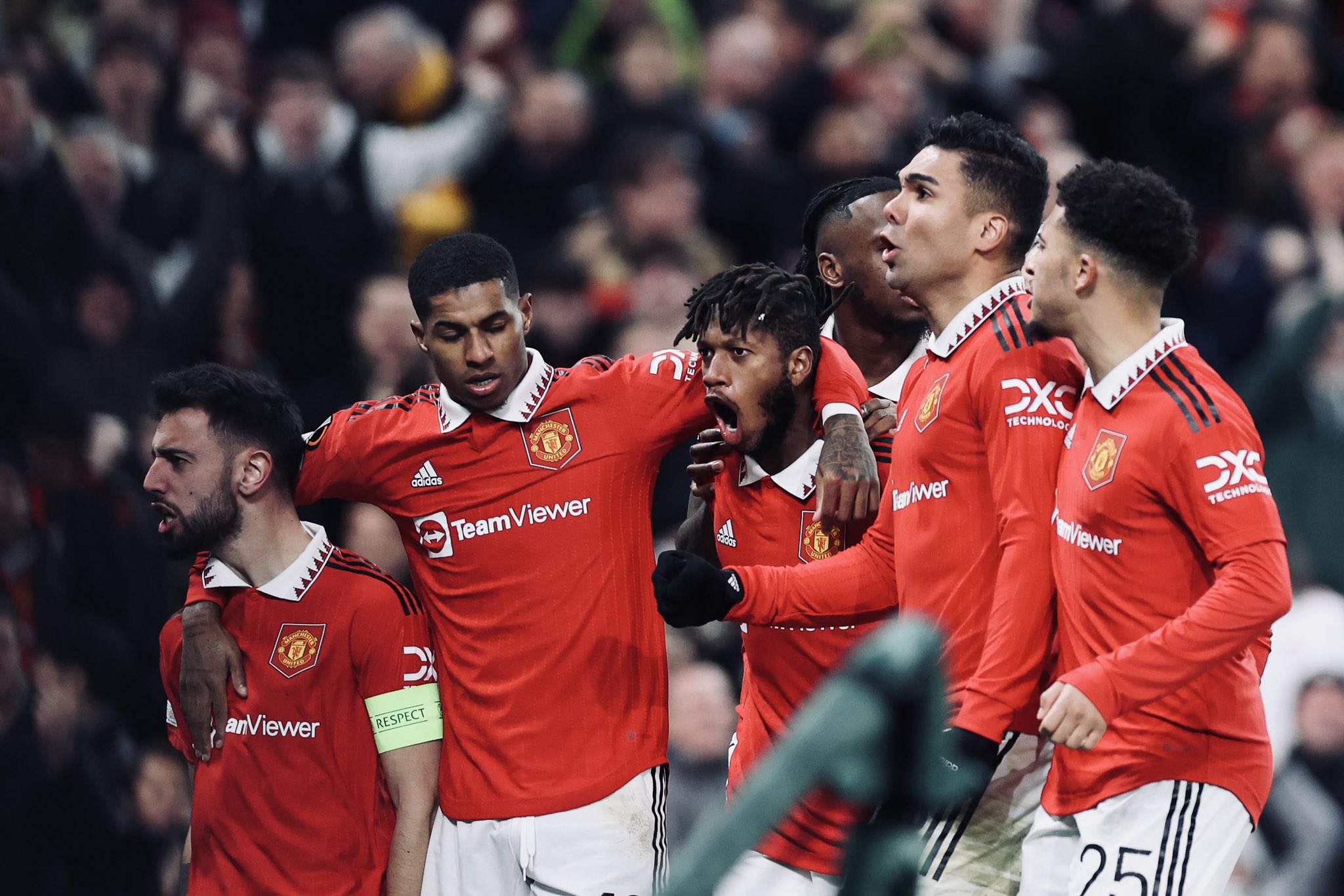United’s players celebrate Fred’s goal.