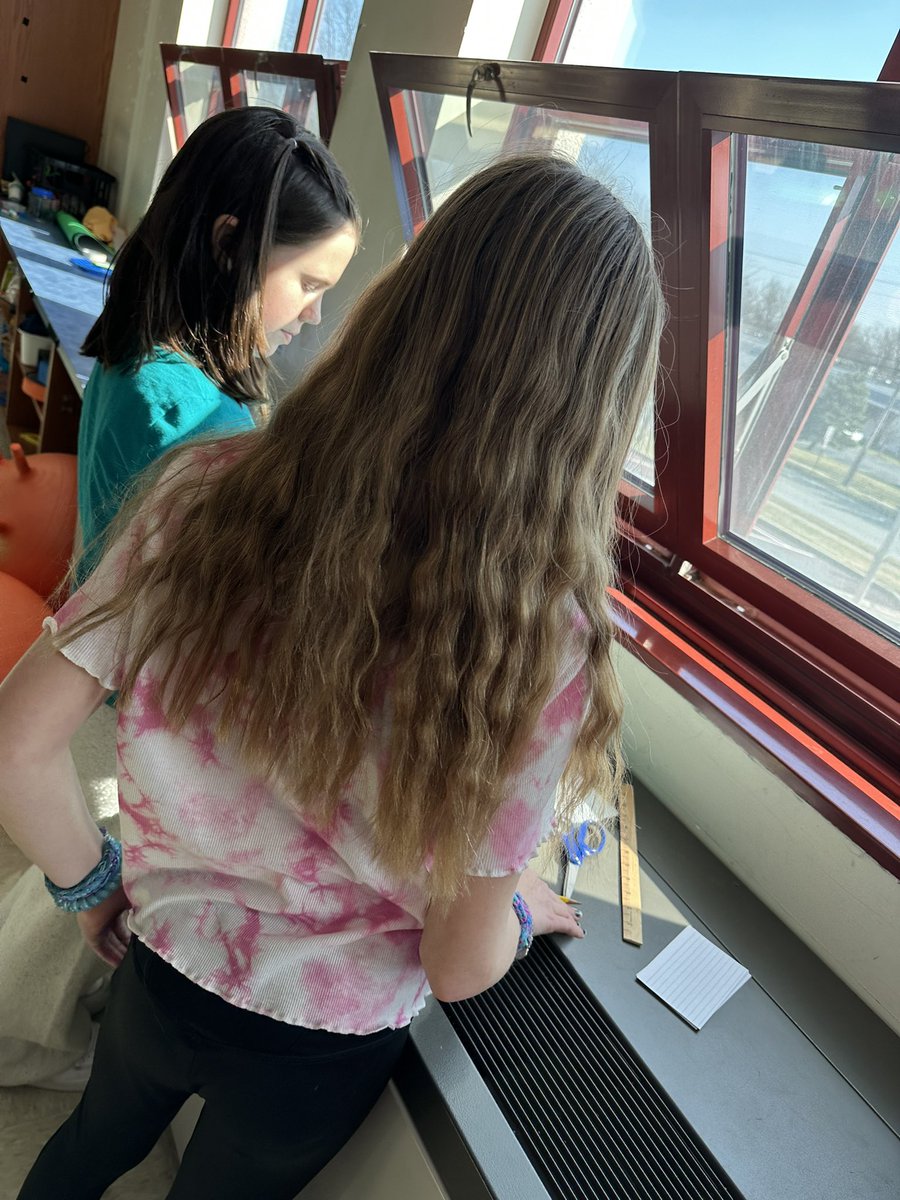 Learning about engineering with a bridge building challenge. Students worked to build the strongest bridge using only index cards and tape. #NationalEngineersWeek