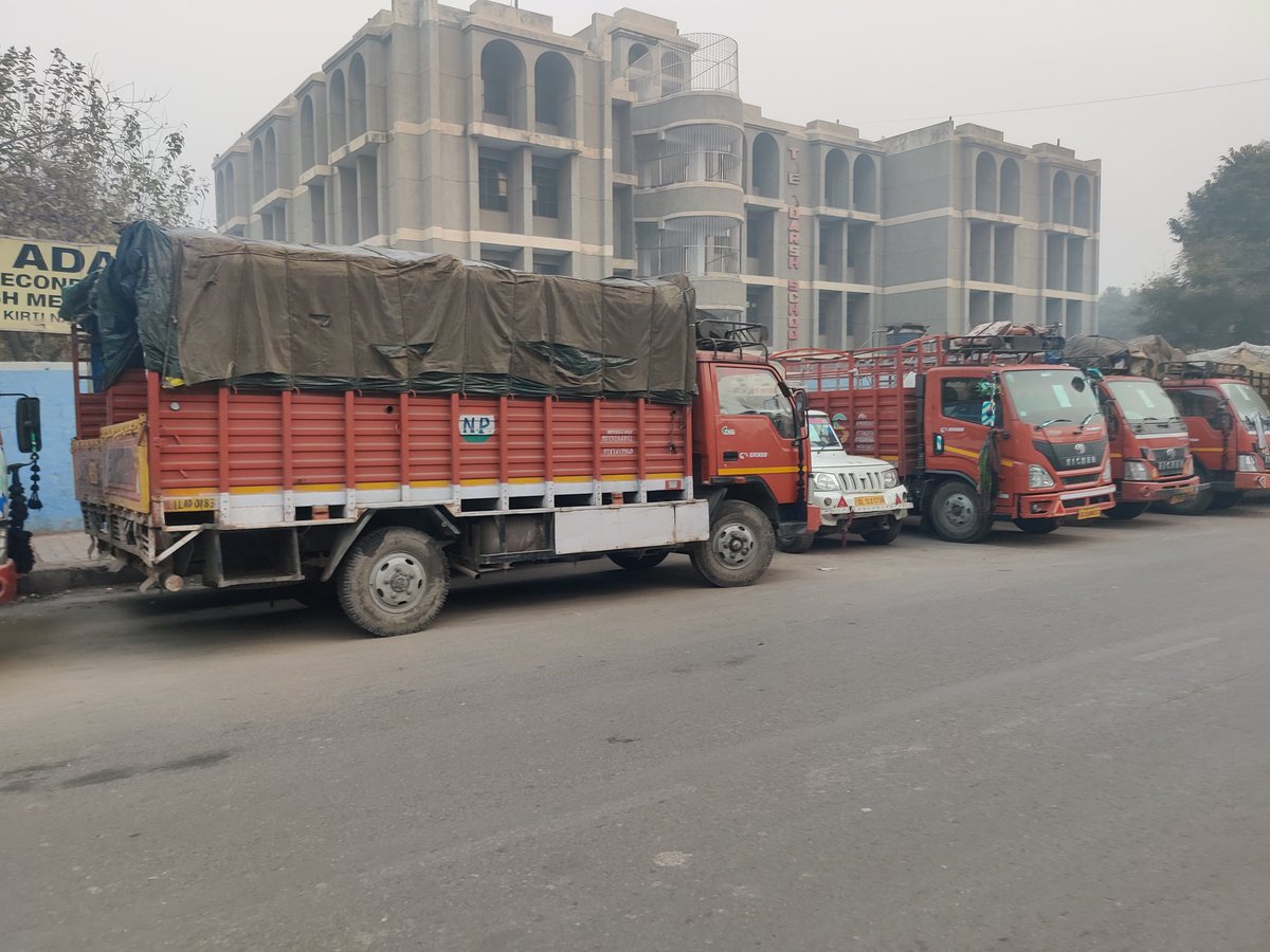 theadarsh_asl's tweet photo. @dtptraffic Unauthorised parking of trucks in front of school gate makes it very difficult for students &amp; parents. They say they have paid to Delhi Police for parking in front of school https://t.co/LRVevvkCM5
