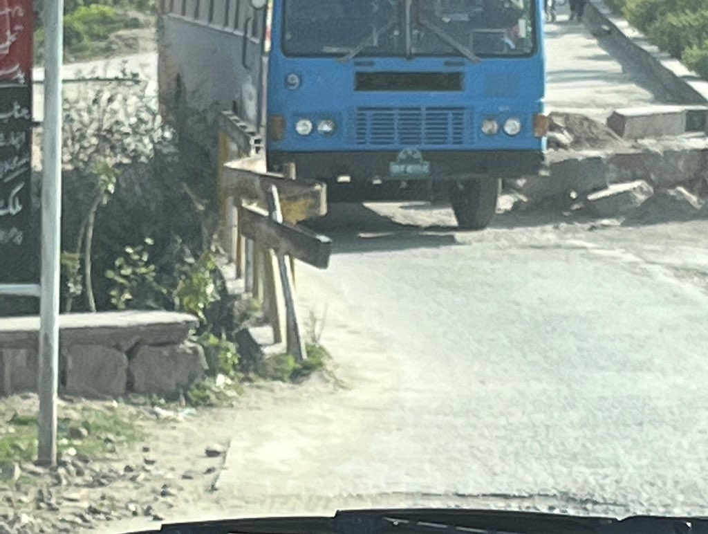 IlhanNiaz's tweet photo. A Quaid I Azam University bus crossing the damaged bridge linking Bari Imam to the university campus while billions are squandered building a bypass through the forested area of the same campus. Perfectly captures our priorities &amp; trajectory as a nation. At least fix the bridge! https://t.co/Fl72he8fC8
