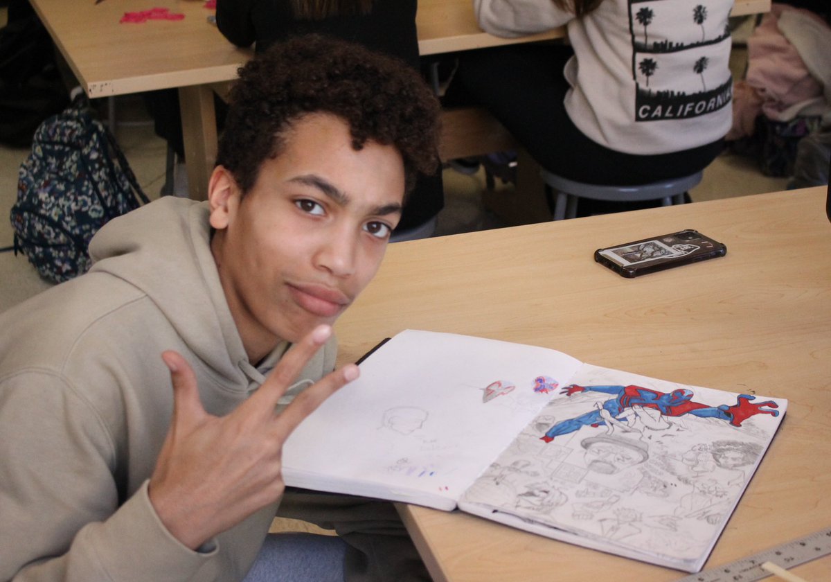PHS_Warrior's tweet photo. Working on a drawing, Billy McFerrin displays his sketch book in World Arts. Photo by Cheyenne McKeever https://t.co/POHKj4oBCb