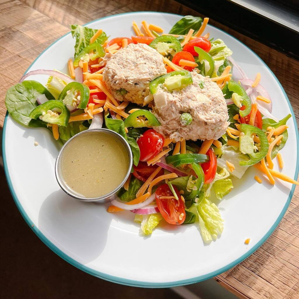 This weeks specials:
Norah’s Snazzy Sammy- all-natural grilled chicken rolled in Frank’s Red Hot sauce with melted Swiss, banana peppers, portobello, grilled onion, &amp; aioli on a grilled hoagie.
Dear Sue- fresh bed of romaine and spinach with tomato, cheddar, onion, jalapeños…
