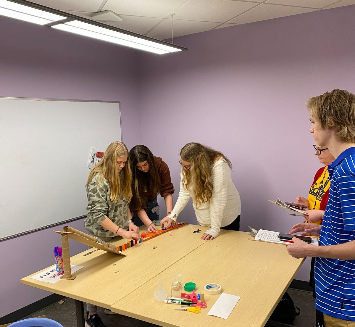 The Chain Reaction contest offered our MS GATE students the challenge to design, build, test, and present a contraption with an end task of "feeding a pet".  Students were able to explore simple machines in greater depth with a focus on creativity, teamwork, and collaboration.