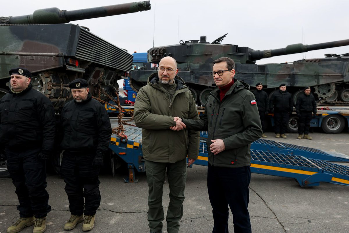 Denys_Shmyhal's tweet photo. Leopard 2 tanks are already in #Ukraine. Together with Prime Minister @MorawieckiM, we met the first tanks provided by partners. We are grateful to Poland 🇵🇱 for the decisive steps that bring 🇺🇦 closer to victory. We are waiting for the expansion of the tank coalition. https://t.co/Brs2iuNelt